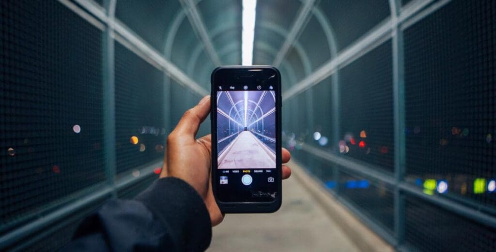 person taking photo with phone